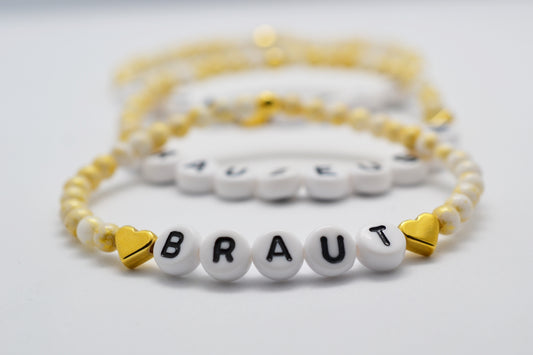Armbänder für Braut Trauzeugin und Brautjungfer in gold weiß übereinander gelegt
