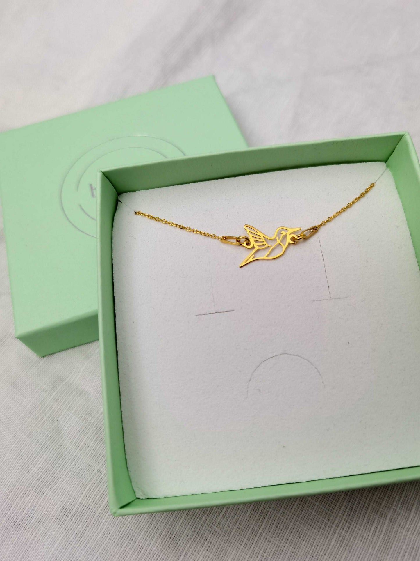 Goldenes Kolibri Armband in mintgrüner Schmuckschachtel
